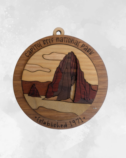 Flo's Banana Stand layered hardwood ornament featuring a red rock monolith landscape of Capitol Reef National Park.