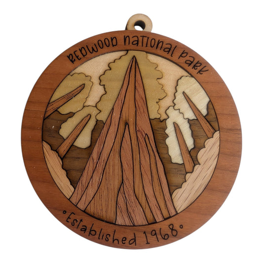 Flo's Banana Stand Redwood National Park layered wooden ornament with intricate forest tree detailing.