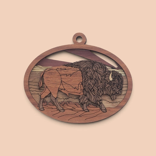 Flo's Banana Stand handcrafted wooden bison ornament with 3D layered landscape design in natural wood tones.