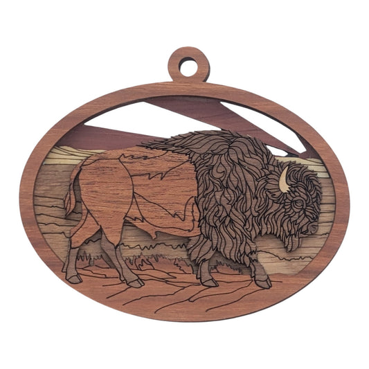 Flo's Banana Stand handcrafted wooden bison ornament with layered 3D landscape detail in natural wood tones.